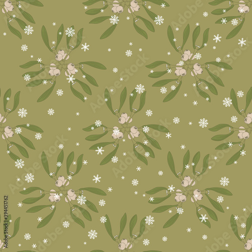 Seamless floral pattern with branches of mistletoe plant and snowflakes.