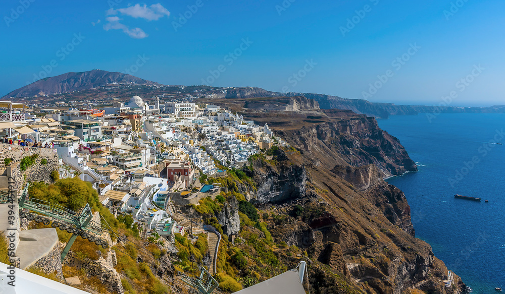 A view over the cable car lift and city of Thira, Santorini in summertime