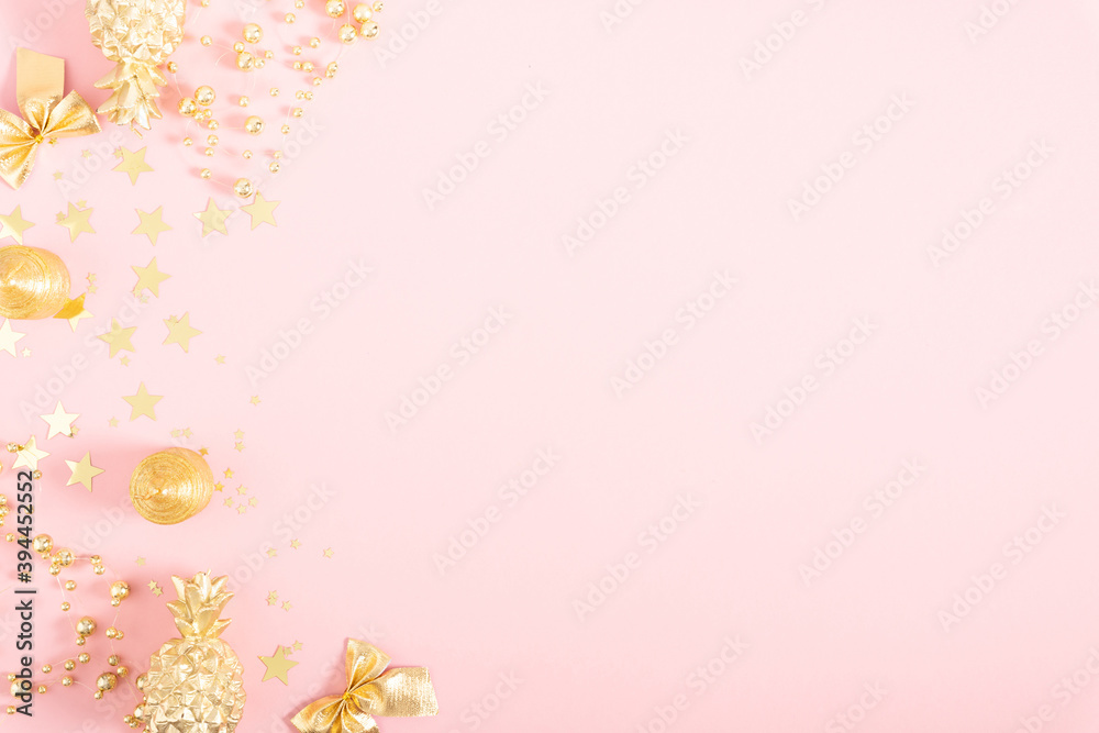 Christmas gold holiday composition. Xmas golden decorations on pink background. Christmas, New Year, winter concept. Flat lay, top view, copy space Christmas gold holiday composition. Xmas golden decorations on pink background. Christmas, New Year, winter concept. Flat lay, top view, copy space