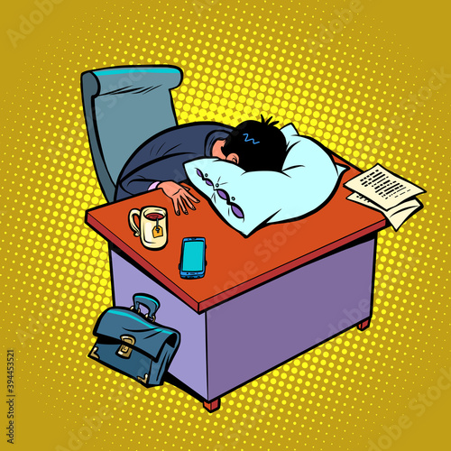 Tired businessman sleeps in the office