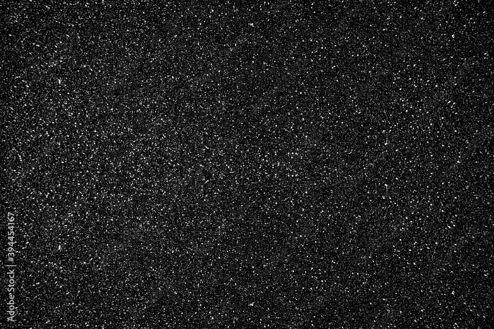 Obraz premium Glitter black background. Photo of monotone shiny background.