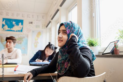 Teenage girl in classroom, Sweden photo