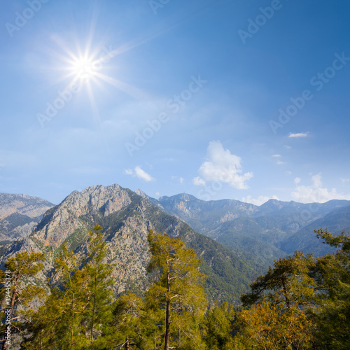 mountain chain under a sparkle sun