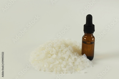 camphor or cinnamomum camphora crystal with camphor oil bottle in white background with copy space photo