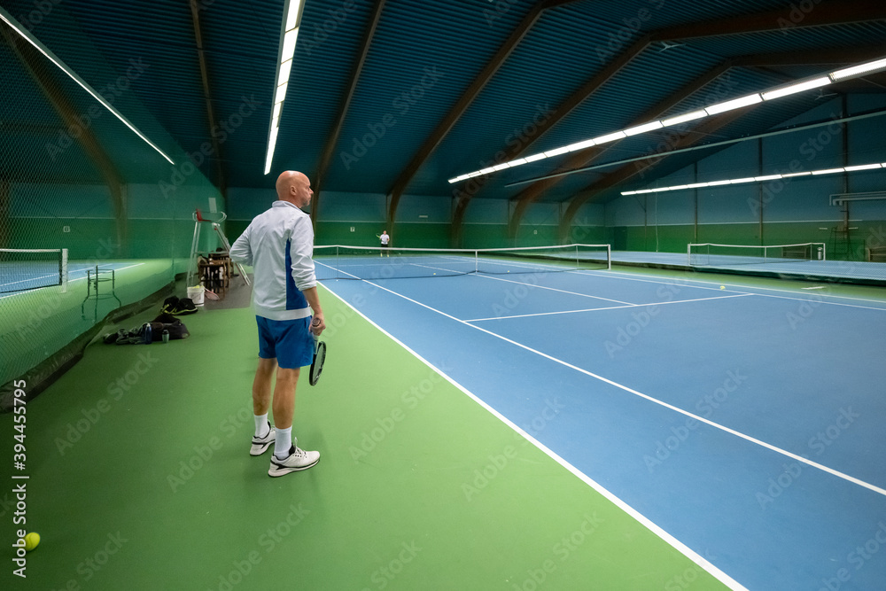 Man at tennis court, Sweden Man at tennis court, Sweden