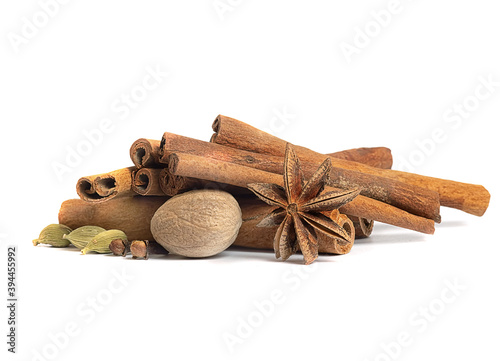 cinnamon sticks and nutmeg spices for mulled wine on a white background