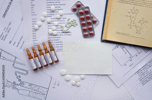 Drugs in tablets and in ampoules over pharmaceutical papers. Drug development, submission and review. Drug dossier preparation. Generic medicaments. 