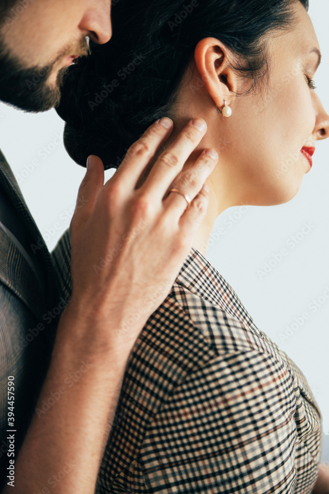 Naklejka premium Family couple. Romantic relationship. Love tenderly. Happy anniversary. Handsome man touching beloved woman enjoying together isolated on white side view.