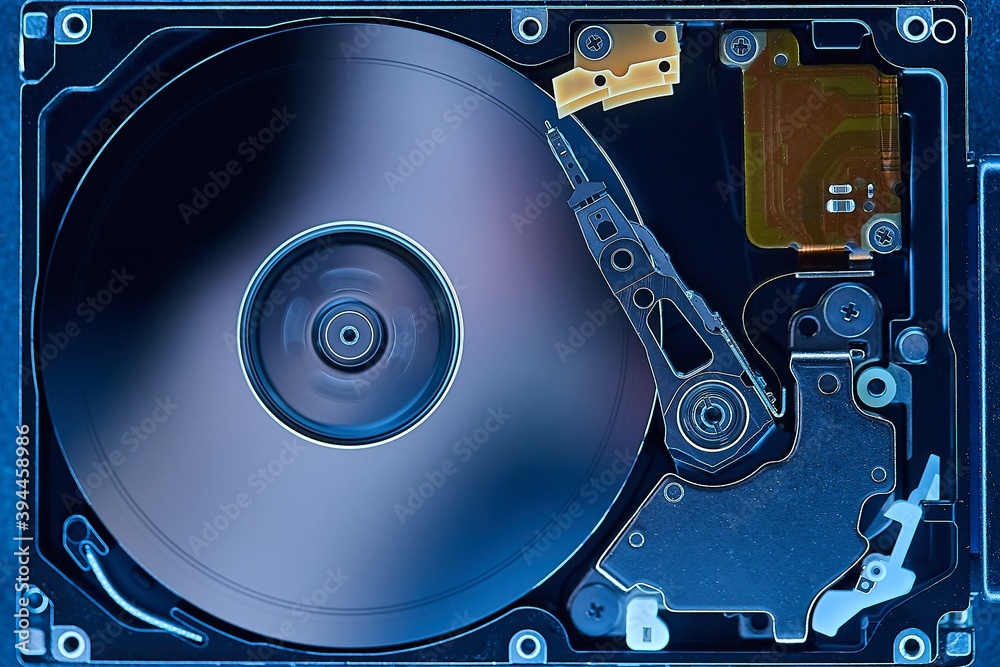 Spinning hard drive disks and writing head illuminated from all sides Spinning hard drive disks and writing head illuminated from all sides