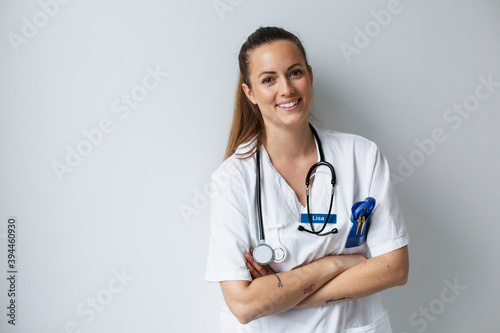 Smiling nurse looking at camera photo