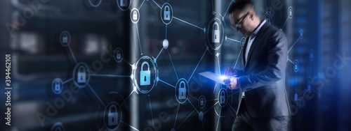 Security data protection concept. Businessman protecting data personal information on tablet and virtual interface.