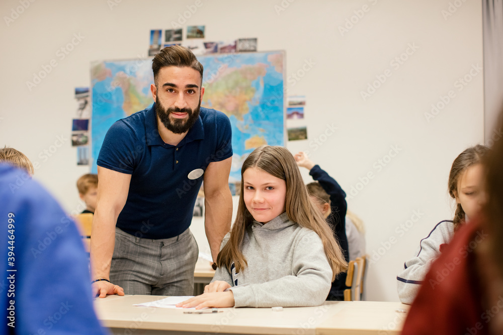 Teacher with schoolgirl in classroom, Sweden Teacher with schoolgirl in classroom, Sweden