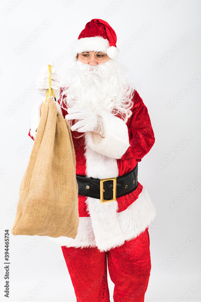 Santa Claus holding sack white background. Christmas concept
