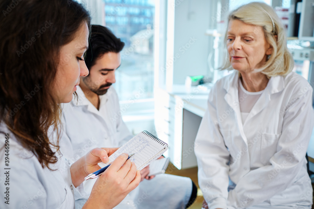 Scientists talking in laboratory, Sweden