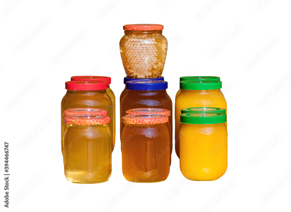 honey in glass jars isolated on white honey in glass jars isolated on white