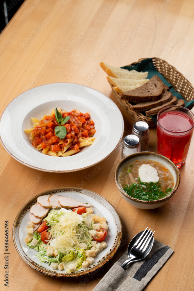 Set lunch in a cafe on wooden table, side top view Set lunch in a cafe on wooden table, side top view