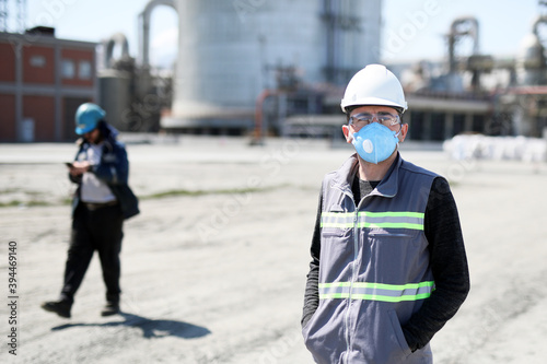 Coronavirus (covid-19) in the construction site. Covid-19 spreads via a number of means, primarily involving saliva and other bodily fluids and excretions. photo