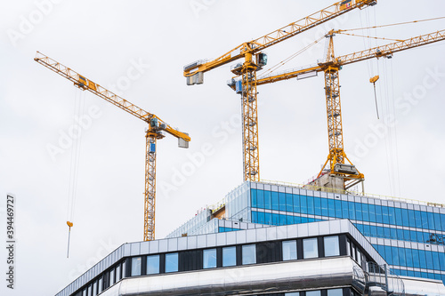 Building cranes on construction site, Sweden