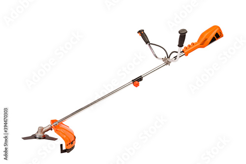 Orange electric lawn trimmer at white background photo