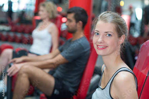 happy woman exercising at gym
