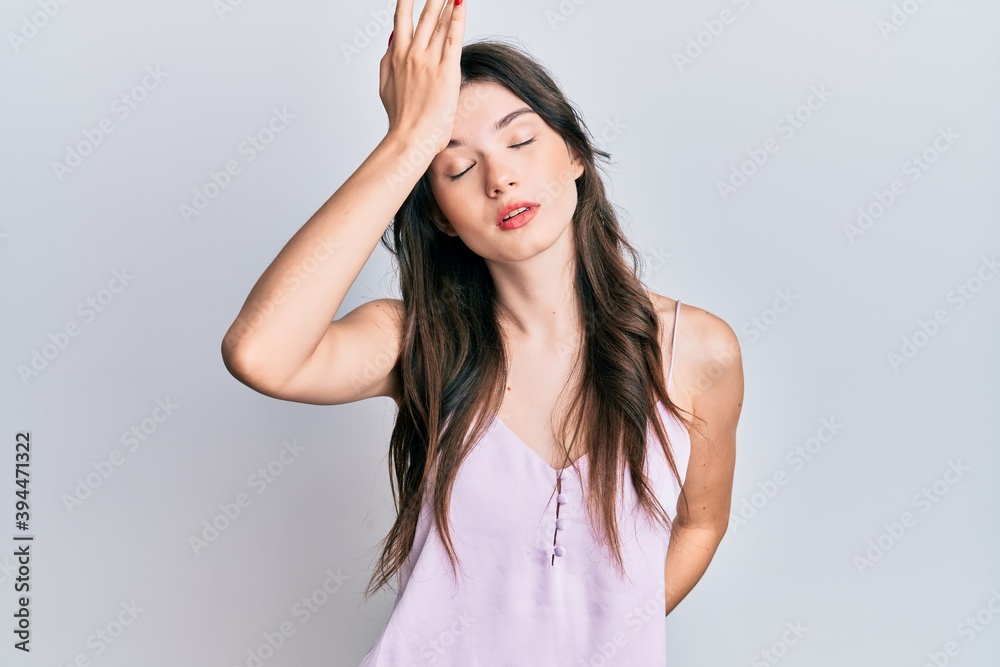 Young beautiful caucasian girl wearing casual clothes surprised with hand on head for mistake, remember error. forgot, bad memory concept. Young beautiful caucasian girl wearing casual clothes surprised with hand on head for mistake, remember error. forgot, bad memory concept.