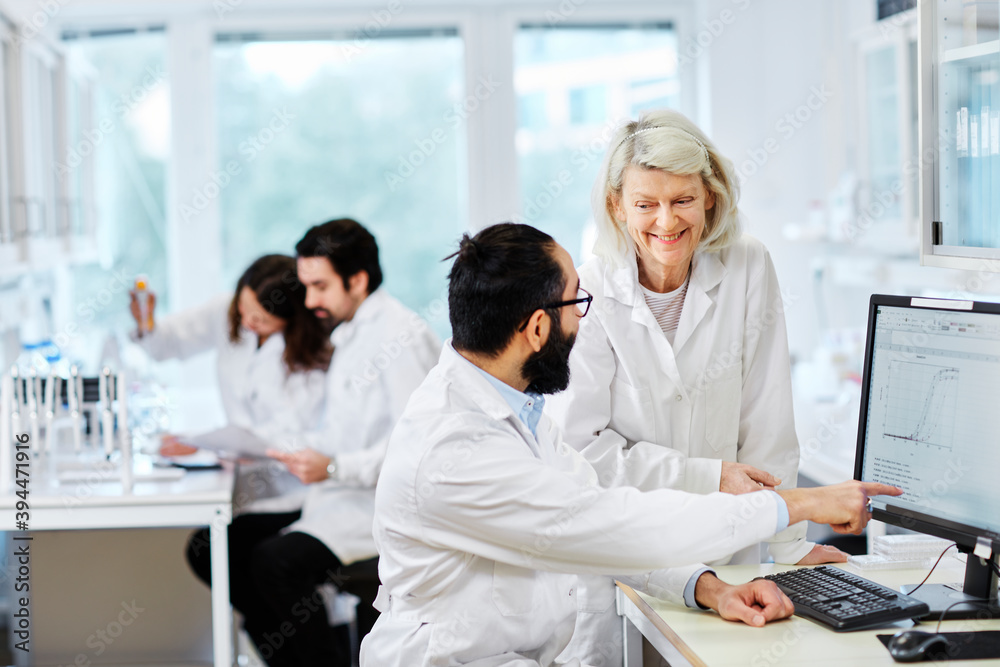 Coworkers talking in laboratory, Sweden Coworkers talking in laboratory, Sweden