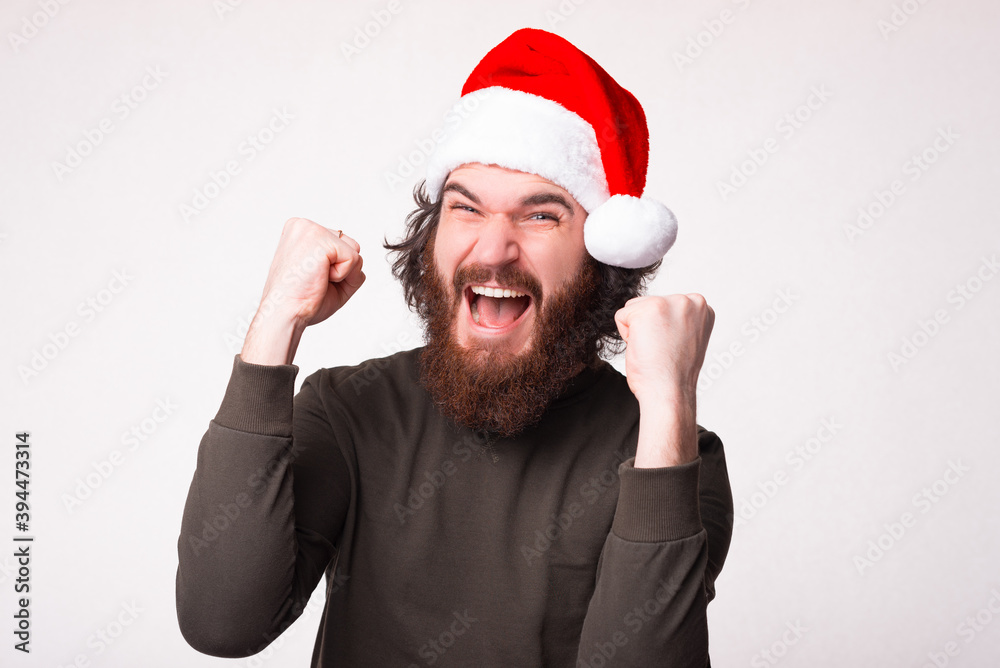 Amazed bearded hipster man waiting for new year 2021 screaming and celebrating Amazed bearded hipster man waiting for new year 2021 screaming and celebrating