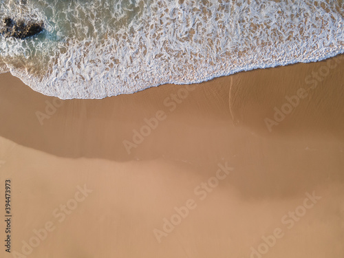 Beach shore wave top view aerial drone shot