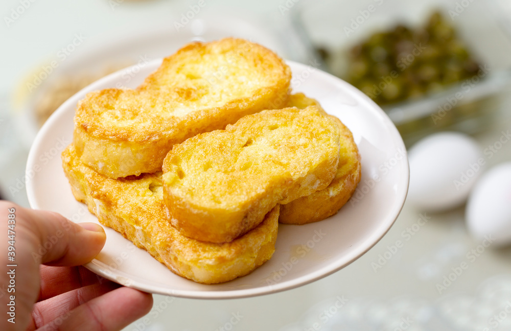 slices of bread with eggs served on a plate slices of bread with eggs served on a plate
