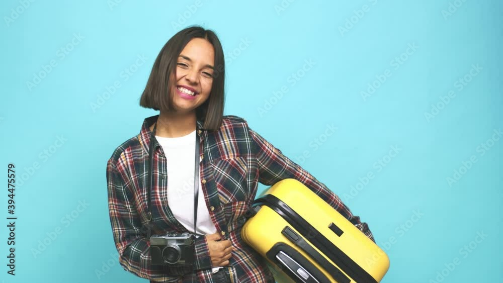 Young latin woman going to travel around the world laughing and having fun Young latin woman going to travel around the world laughing and having fun