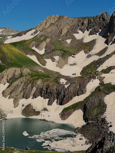 View of a lake in mountains. Hakkari cilo sat lakes, snowy mountains and natural scenery
 photo