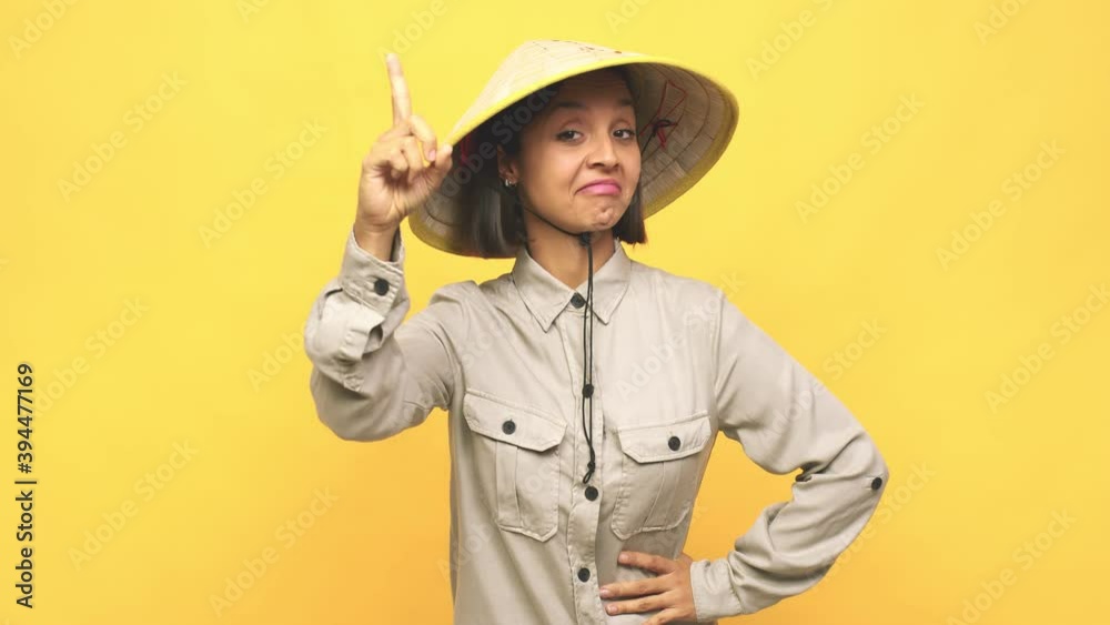 Young latin woman with vietnamite hat having an idea, inspiration concept Young latin woman with vietnamite hat having an idea, inspiration concept