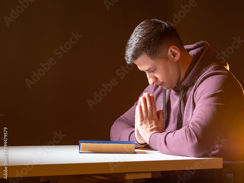 Photography Man prays at the table