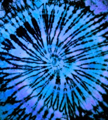 Reverse spiral tie dye in blue. Hippie tie-dye pattern texture background wallpaper.