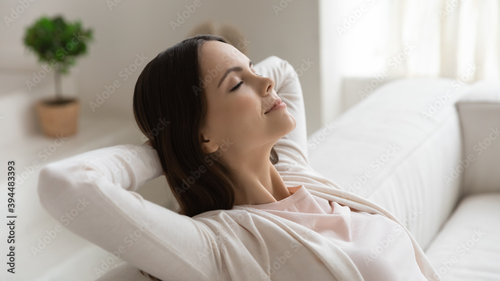 Weekend, at least .. Tranquil peaceful millennial female enjoying freedom napping dreaming relaxing on couch with closed eyes and hands behind head meditating breathing fresh air feeling happy serene Weekend, at least .. Tranquil peaceful millennial female enjoying freedom napping dreaming relaxing on couch with closed eyes and hands behind head meditating breathing fresh air feeling happy serene