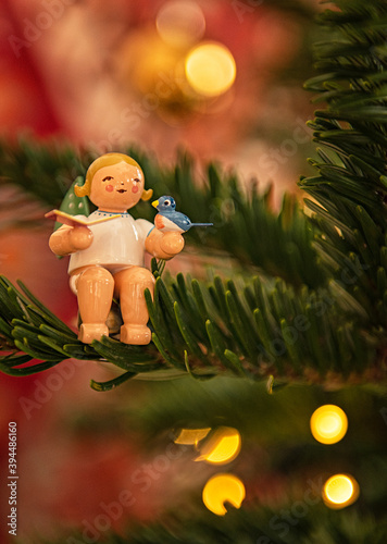 Vintage wooden toy angel with Christmas clothes, traditional figurine of Chri...