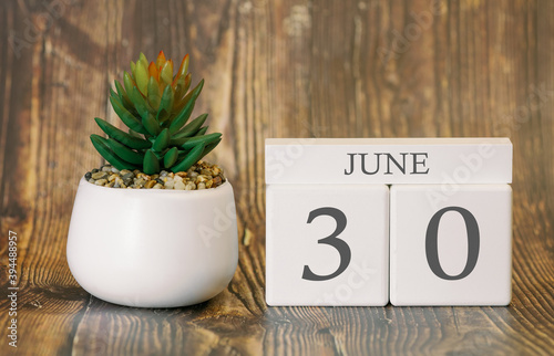 Flower pot and calendar for the warm season from 30 June. Summer time.