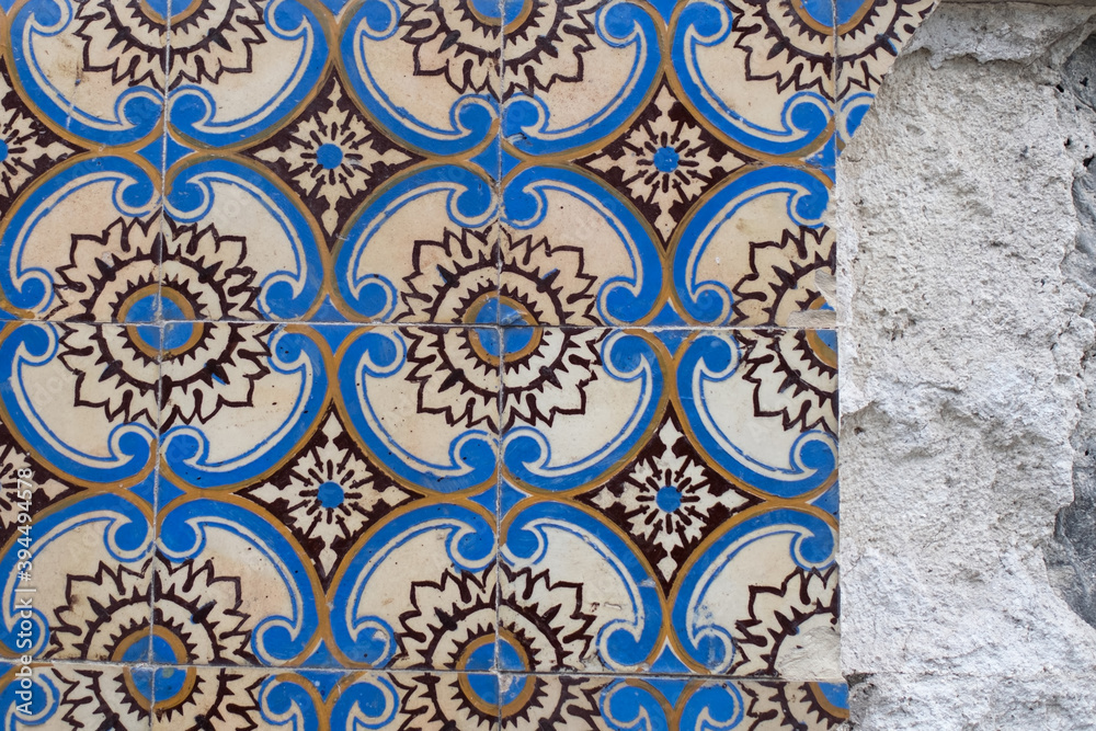 Traditional old tiles wall on the street Portuguese, azulejos ceramic tilework. Porto, Portugal.