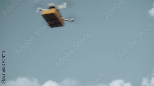 flying on a sky delivery drone with holding a .cardboard parcel photo