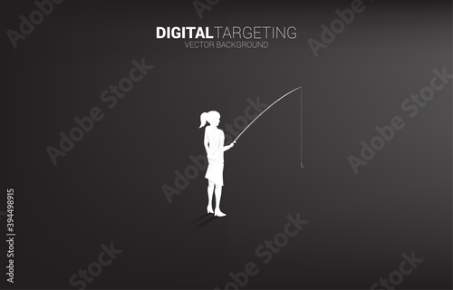 Silhouette of businesswoman standing with fishing hook. Concept of targeting and bait in business.