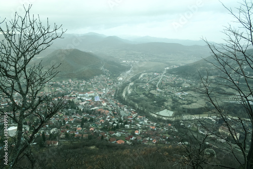 Panorama of the city of Zvecan, in the northern part of Kosovo, with a serb majority of population, in winter, with the mountain range of Ibarski Kolasin and the ibar river photo