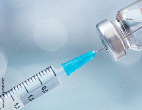 close-up view of syringe and pills 