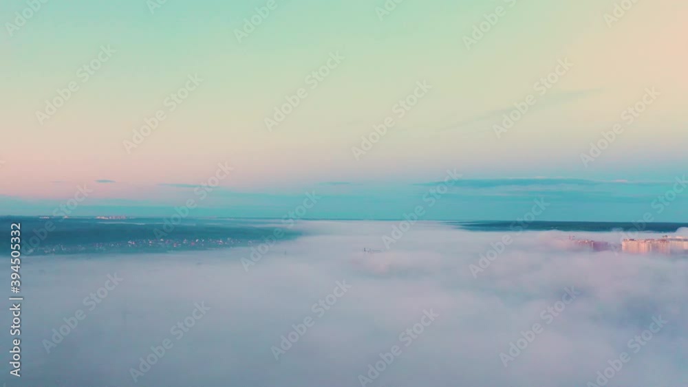 Unfinished high-rise buildings in the fog at dawn. Unfinished high-rise buildings in the fog at dawn.