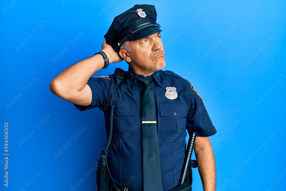 Handsome middle age mature man wearing police uniform confuse and wondering about question. uncertain with doubt, thinking with hand on head. pensive concept. Handsome middle age mature man wearing police uniform confuse and wondering about question. uncertain with doubt, thinking with hand on head. pensive concept.