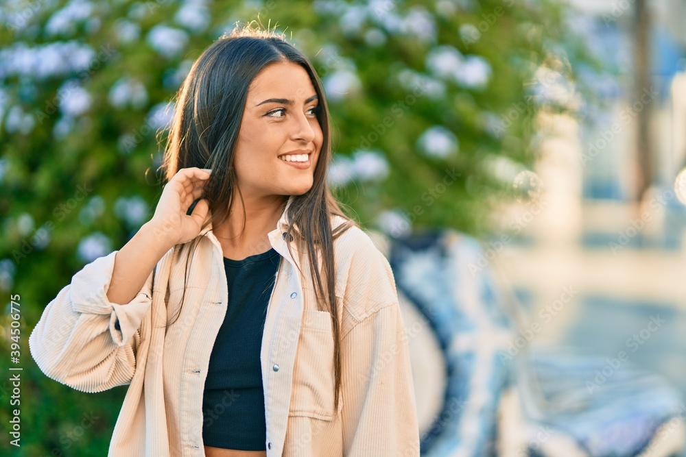 Young hispanic girl smiling happy standing at the park. Young hispanic girl smiling happy standing at the park.