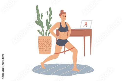 Woman does lunges with a rubber loop resistance band. Exercises for the legs and buttocks at home.