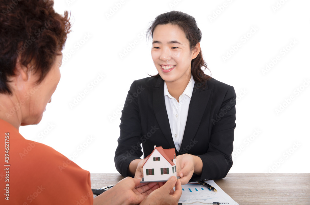 The real estate sales staff happily handed the house model to the owner The real estate sales staff happily handed the house model to the owner
