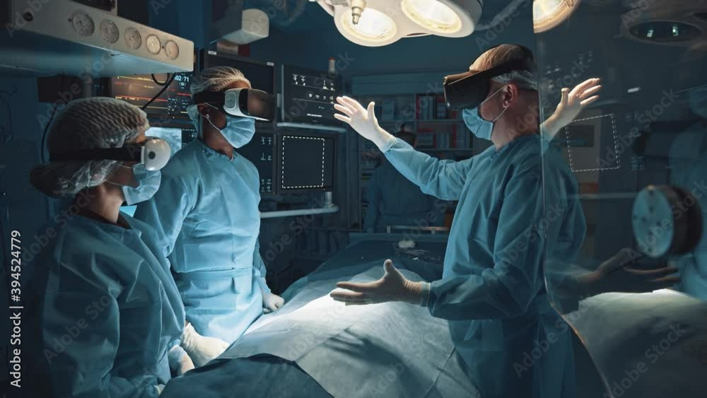 Diverse skillful surgeons performing heart surgery using virtual reality simulation medical app for surgical operation wearing VR headsets for interaction.