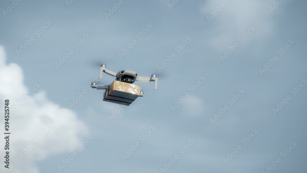 flying on a sky delivery drone with holding a .cardboard parcel