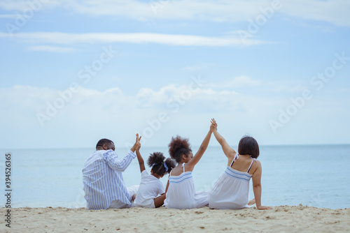 Ethnicity Happy Family Africans Enjoy relaxation resting on the beach summer